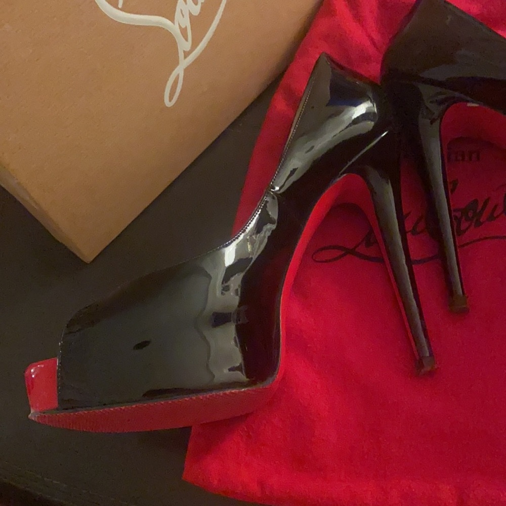 Authentic black rare patient leather with red toe & platform. Comfortable!